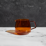 Tan glass tea cup