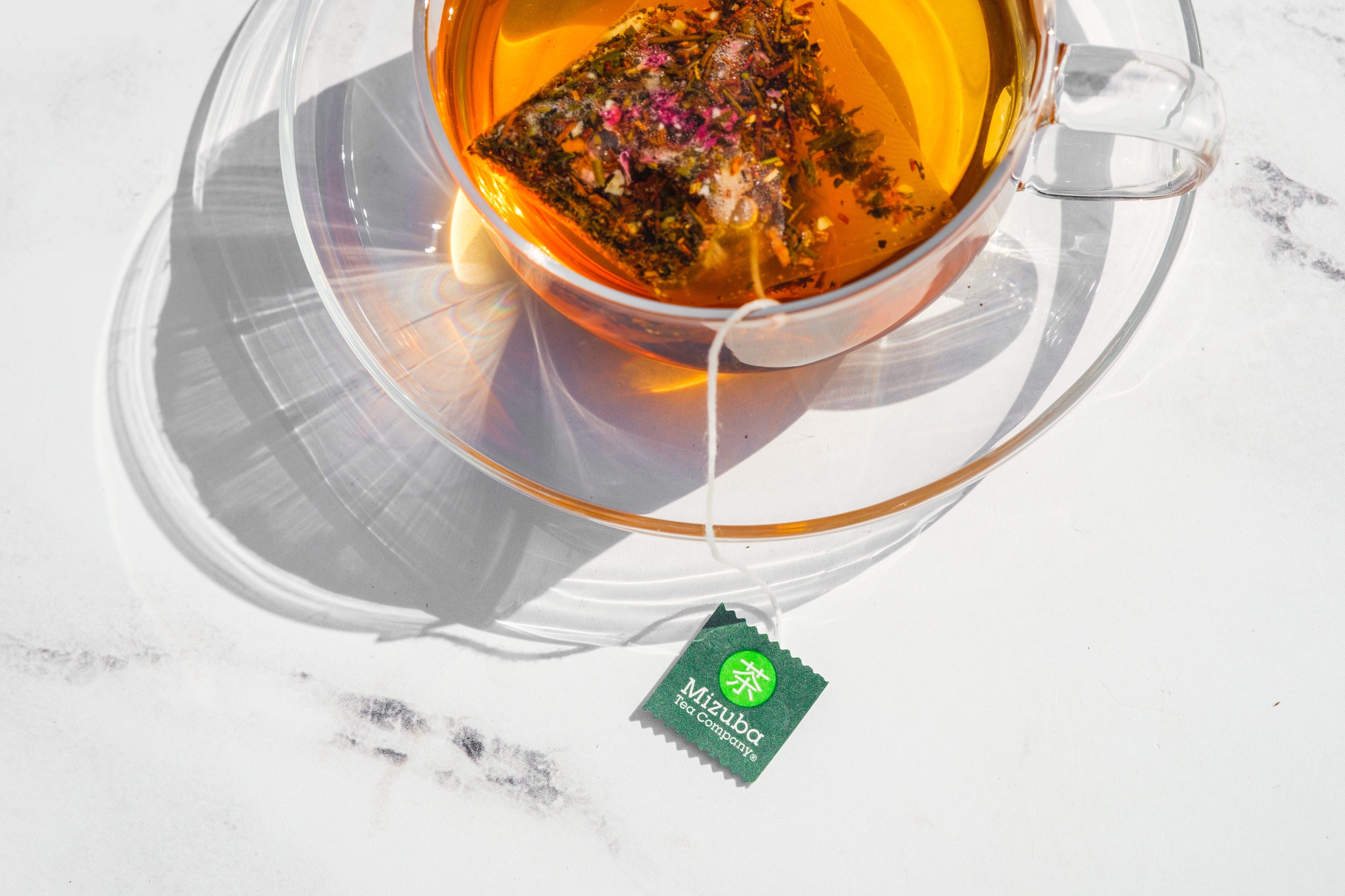 Mizuba Tea Sachet brewing in a glass mug
