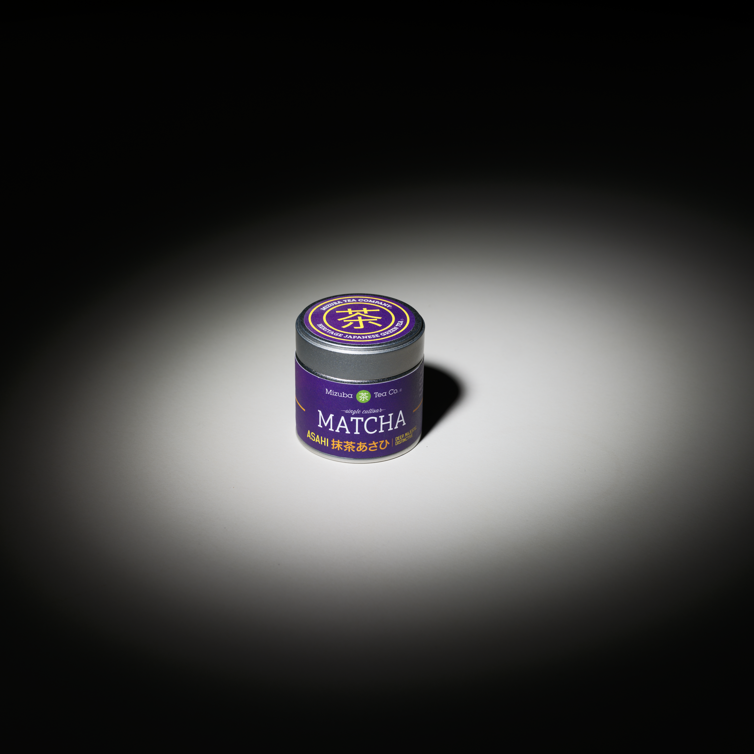 Asahi Matcha powder tin on a white table