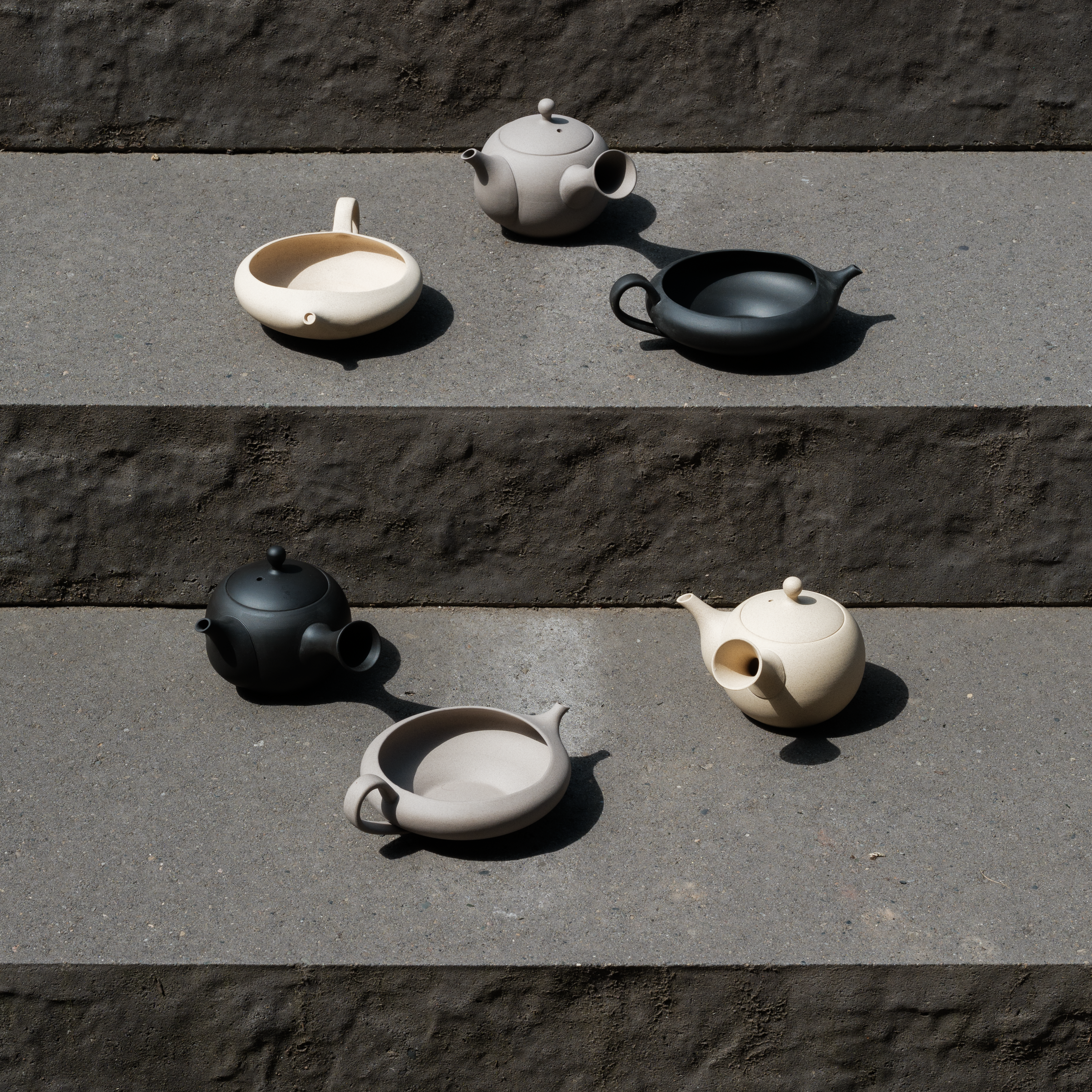 Jinsui Tokoname Japanese ceramic collection in beige, black, and grey. 