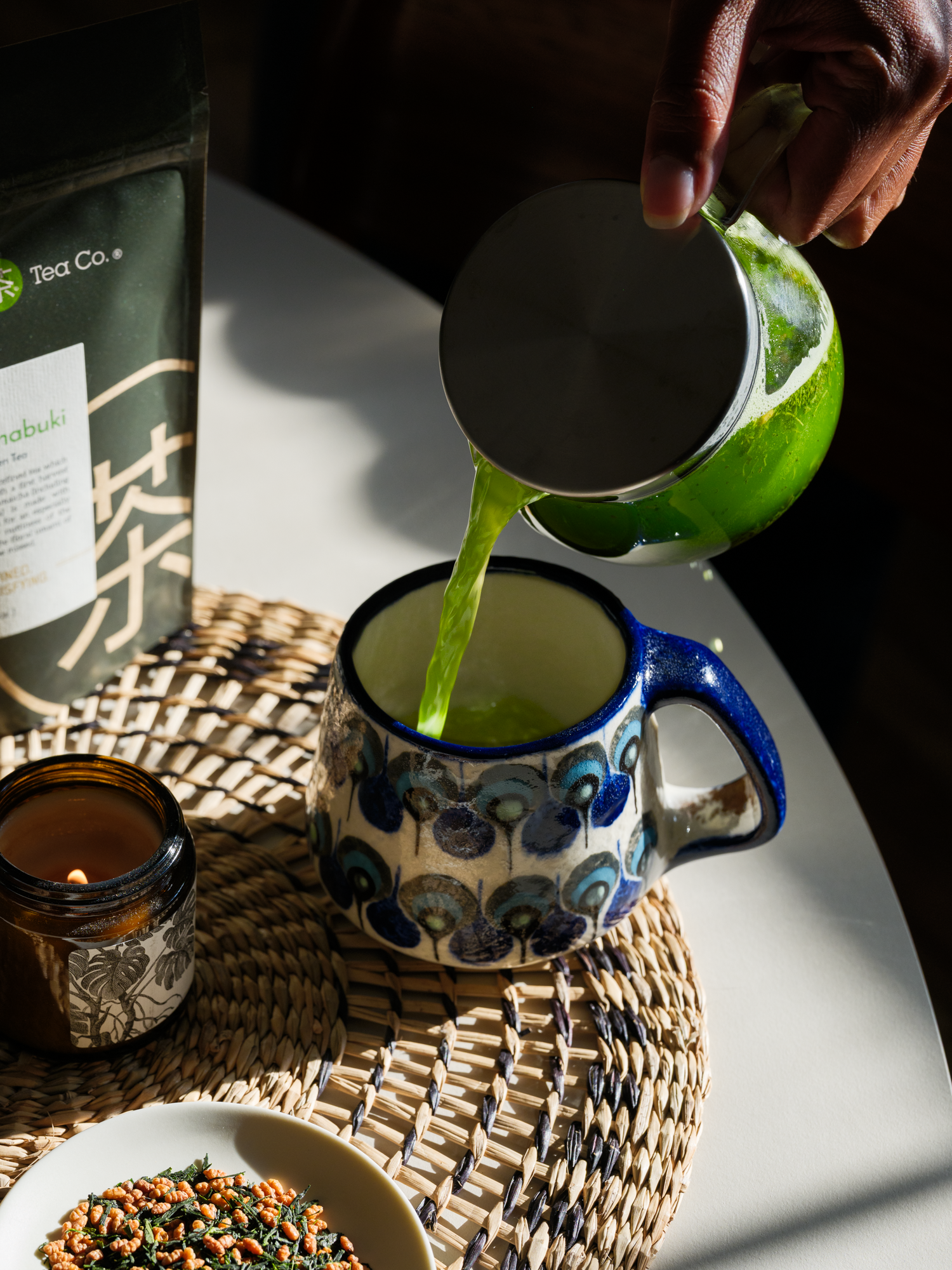 Matcha being poured into a ceramic cup

