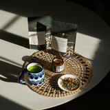Mizuba Loose Leaf Teas packages and brewed teas on a table