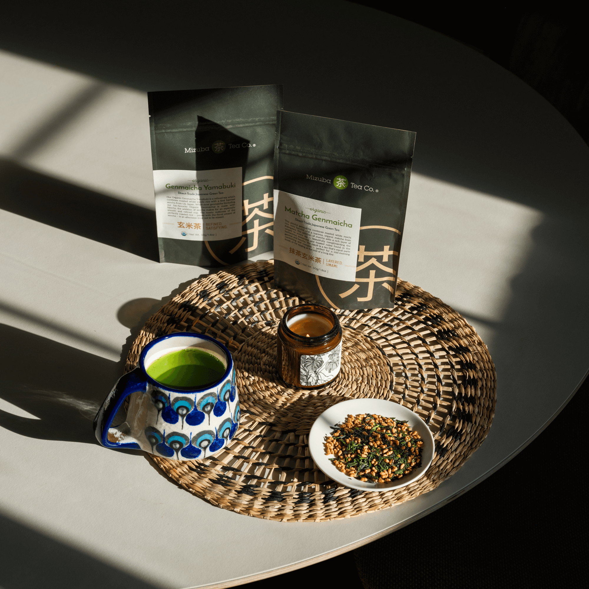 Mizuba Loose Leaf Teas packages and brewed teas on a table
