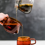 KINTO tea collection with tea pot, sepia pitcher, and glass tea cup - photo by Mizuba Tea Co.