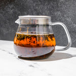 Organic Hojicha Japanese tea brewing in a glass KINTO teapot - Mizuba Tea Co.